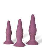 The three interchangeable mauve Radicus forms, with textured surfaces and flared bases.