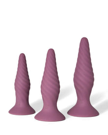 The three interchangeable mauve Radicus forms, with textured surfaces and flared bases.